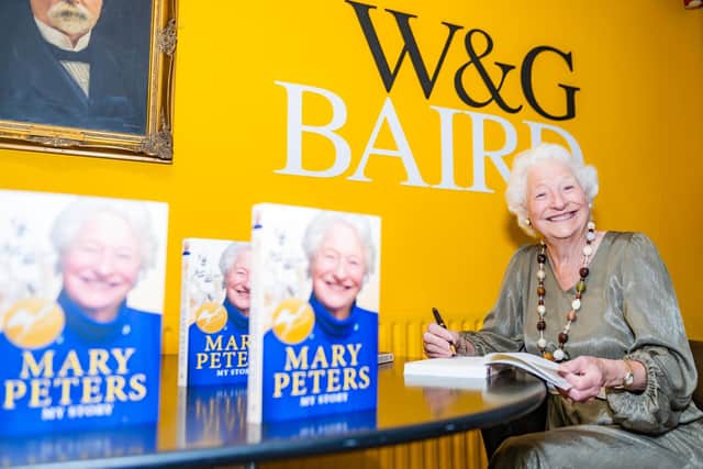 Sporting legend Lady Mary Peters, eagerly examined the first copies of her new highly anticipated autobiography, 'Mary Peters, My Story.'