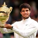 Carlos Alcaraz of Spain with the men's singles trophy following his victory against Novak Djokovic at Wimbledon. (Photo by Julian Finney/Getty Images)