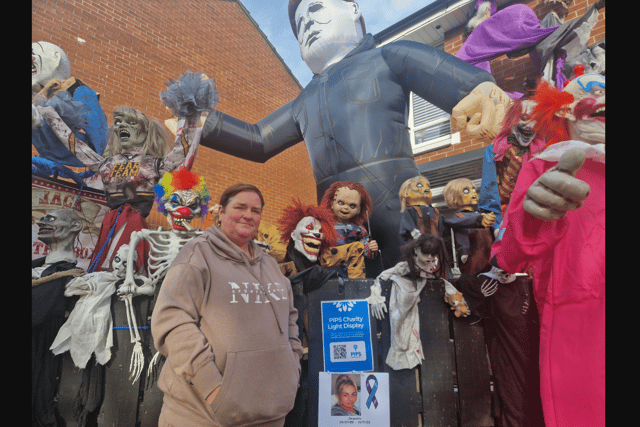 Lynn Nelson and the spooky pals in her front garden are raising money for suicide prevention charity PIPS. Photo: Iain Gray/News Letter