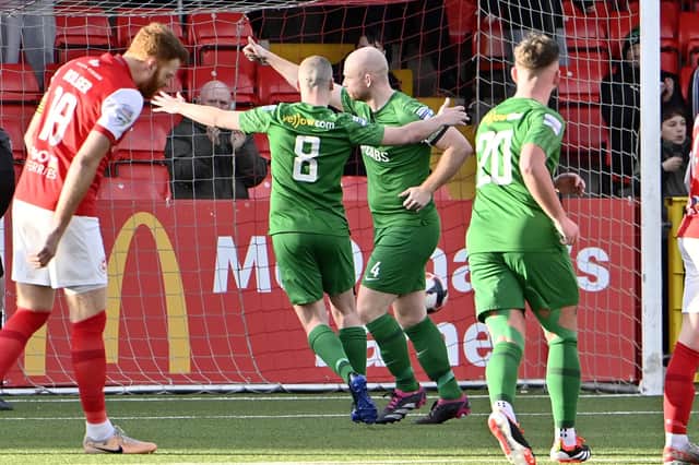 Newington’s Eamonn Hughes celebrates scoring a penalty in the Irish Cup tie against Larne at Inver Park