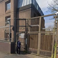 Woman charged with intimidating witness in court