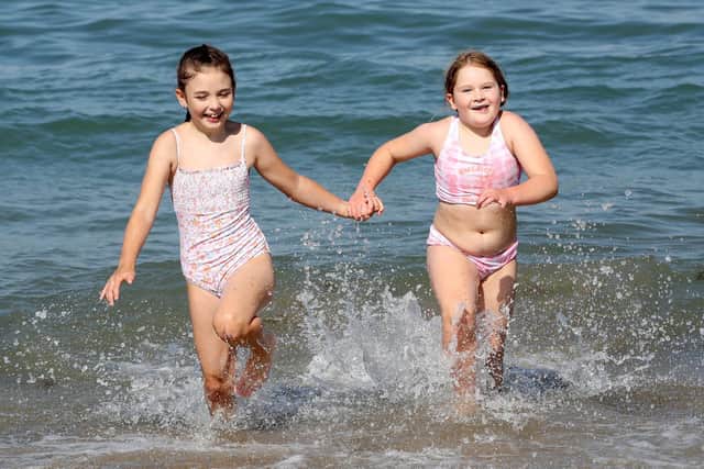 (L-R) Kara Jackson and Scarlet Doherty both aged 9 at Helens Bay Beach last August.