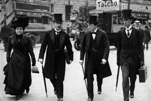 April 1910: Winston Churchill listens attentively to David Lloyd George, Chancellor of the Exchequer, while walking in Central London with him, his wife and his parliamentary aide on Budget Day. Left to right:  Margaret Lloyd George, David Lloyd George, Winston Churchill and Mr Clarke (Private Secretary to Mr Lloyd George).   (Photo by Central Press/Getty Images)