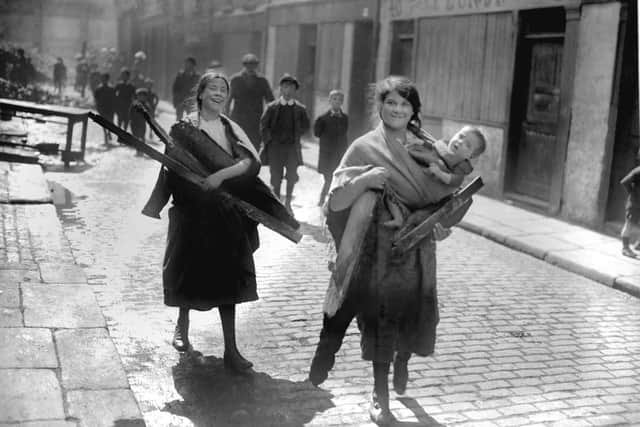 Children carry wood from Sackville Street, Dublin after the Sinn Fein rising on 1916. Picture: PA Archive/PA Images