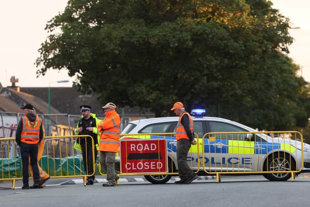 Manx police and race marshals at the Southern 100 race course on the Isle of Man where there was a serious incident on Tuesday evening resulting in two fatalities.