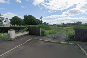 The development is slated for empty land next to a church. Image: Google