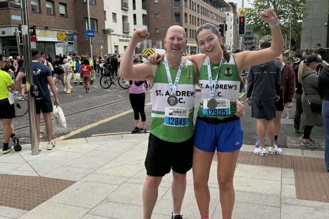 Noel Williamson and his daughter after completing the Dublin Half Marathon for charity