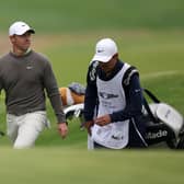 Rory McIlroy and caddie Harry Diamond walk to the seventh green during the third round of The Genesis Invitational at Riviera Country Club.