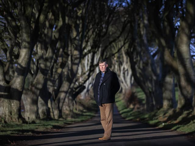 DUP Councillor Mervyn Storey of Causeway Coast and Glens Borough Council at the Dark Hedges near Armoy in Co Antrim. The tunnel of trees became famous when it was featured in the HBO fantasy series Game Of Thrones and now attracts significant numbers of tourists from around the world. Photo: Liam McBurney/PA Wire