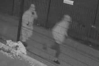 The two gunmen as they approach Beechmount after the shooting of Mark Hall at his family home in Rodney Drive on 18 December 2021.