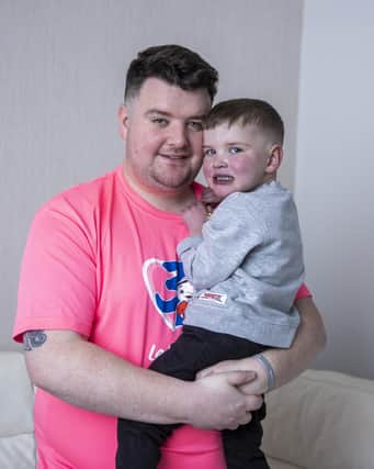 Daithi MacGabhann with his dad Mairtin MacGabhann at their home in Belfast. The father of a young boy who has been waiting over three years for a new heart is remaining hopeful that proposed organ donation reforms will be passed by Stormont in the coming months. The legislation is one of more than 30 pieces which have just months to become law in Northern Ireland before the next Stormont Assembly election. Picture date: Wednesday December 22, 2021.