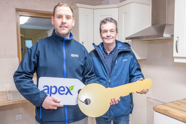 Former deep-sea fisherman, Philip Morton from Ballycastle, was one of the lucky people receiving the keys to his new home in Dunineany View recently. Pictured with Marc McLaughlin from Apex Housing Association