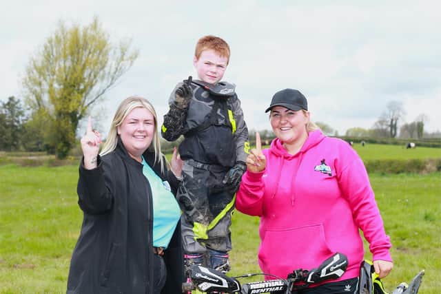 Jenson Gilchrist, winner of the Y1 quad class at Tandragee, with his two biggest fans Courtney McMullen and Natasha Gilchrist