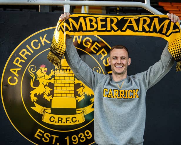 Seanan Clucas has signed for Carrick Rangers on a three-year deal after his release from Glentoran