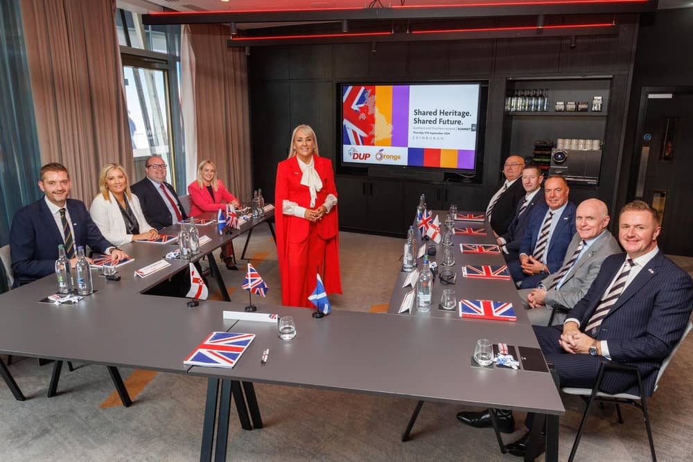 Marie Macklin in centre standing with summit attendees in Edinburgh.