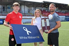 Tahnee McCorry from White Ribbon Northern Ireland pictured with Crusaders goalkeeper Johnny Tuffey and Larne's Micheal Glynn ahead of this year's Charity Shield match between the two sides