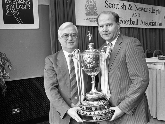Pictured in February 1992 is Alastair Mowart, right, group managing director Scottish and Newcastle Breweries and Ivan Marshall of the Intermediate Committee with the re-named William Youngers Intermediate Challenge Cup, part of a sponsorship package with was announced by the IFA. Picture: News Letter archives