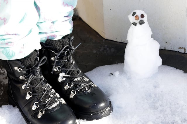 A small snowman left at Lisburn City Cathedral after heavy snowfall overnight.