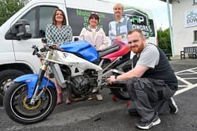 Motorcycle enthusiast Chris Howard has turned his passion for motorcycles and motorcycle racing into his very own motorcycle repair business, CHP Motoworks, thanks to the help of the Go For It programme in association with Newry, Mourne and Down District Council.  Pictured are Joan O’Hara, business advisor at Down Business Centre, councillor Valerie Harte, chair of Newry, Mourne and Down District Council, Janice McDonald, Down Business Centre and Chris Howard, founder of CHP Motoworks (simongraham.photography)