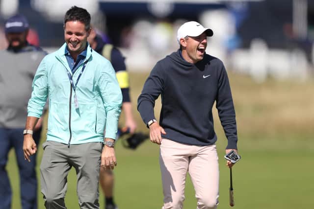 Rory McIlroy (right) shares a laugh during Monday's practice round prior to The Open at Royal Liverpool. (Photo by Warren Little/Getty Images)