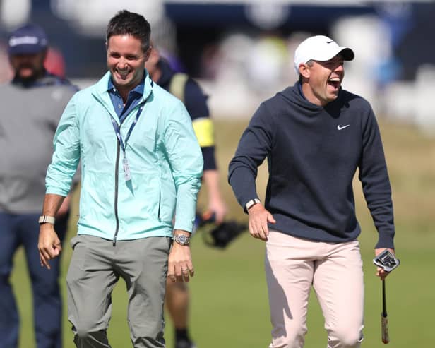 Rory McIlroy (right) shares a laugh during Monday's practice round prior to The Open at Royal Liverpool. (Photo by Warren Little/Getty Images)