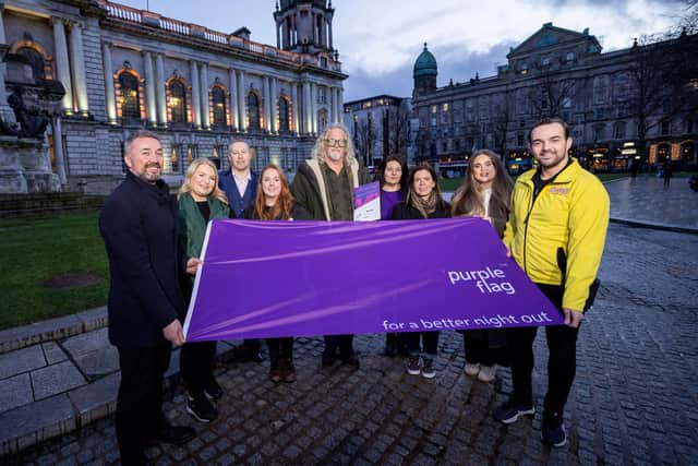 Members of the Belfast Purple Flag Steering Group celebrating the renewed status at City Hall this week