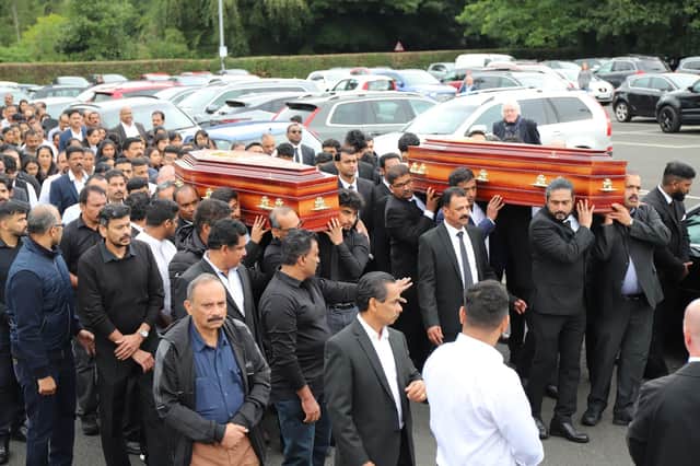 The coffins of Reuven Simon and Joseph Sebastian are brought from St Mary's Church in Ardmore, Co Londonderry, following their funeral. The 16-year-olds died after getting into difficulty while swimming at Lough Enagh on Monday evening. Picture date: Friday September 2, 2022.