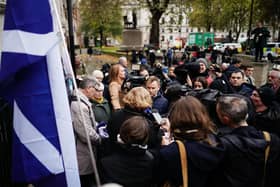 The media talk to supporters outside the UK Supreme Court in London, following the decision by Supreme Court judges that the Scottish Parliament does not have the power to hold a second independence referendum. PA Photo.