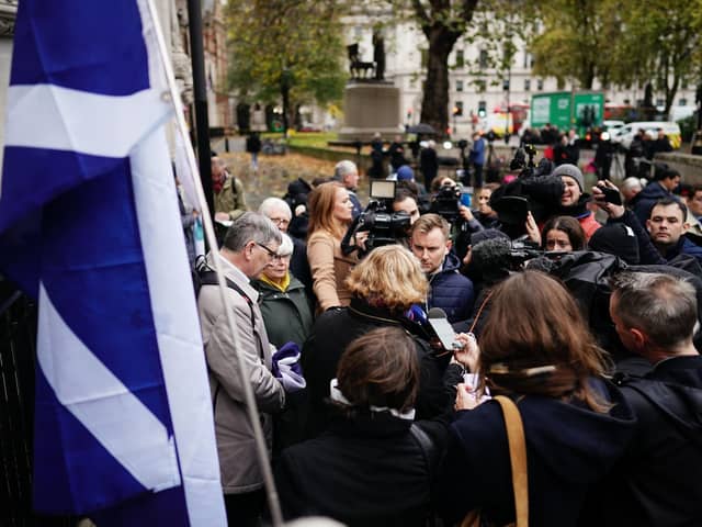 The media talk to supporters outside the UK Supreme Court in London, following the decision by Supreme Court judges that the Scottish Parliament does not have the power to hold a second independence referendum. PA Photo.