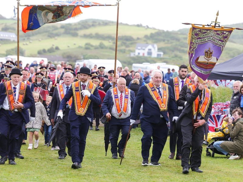 The parade makes its way through the village