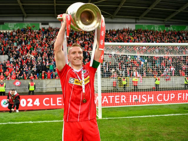 Cliftonville midfielder Chris Curran finished his playing career by lifting the Irish Cup against Linfield at Windsor Park