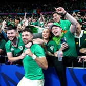 Ireland's Hugo Keenan celebrates with fans after the final whistle following victory over South Africa at the Stade de France on Saturday