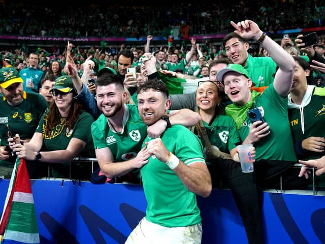 Ireland's Hugo Keenan celebrates with fans after the final whistle following victory over South Africa at the Stade de France on Saturday
