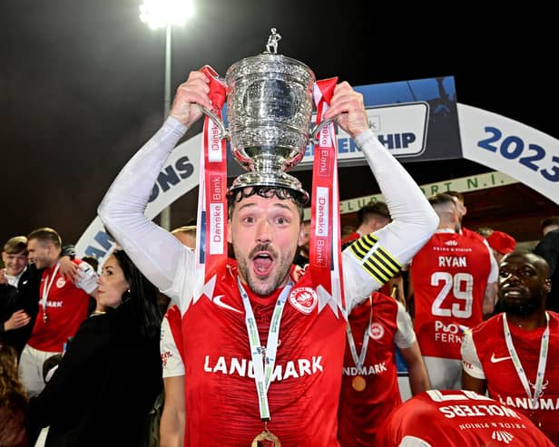 Larne captain Tomas Cosgrove lifted the Premiership title after their last home meeting with Linfield at the end of last season. PIC: INPHO/Stephen Hamilton