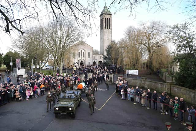 Members of the defence forces carry the coffin on a gun carriage through the village of Dunboyne after the state funeral of former taoiseach John Bruton, at St Peter and Paul's Church, in the village in Co Meath before burial in Rooske Cemetery, Dunboyne. Photo: Julien Behal/Government Information Service/PA Wire