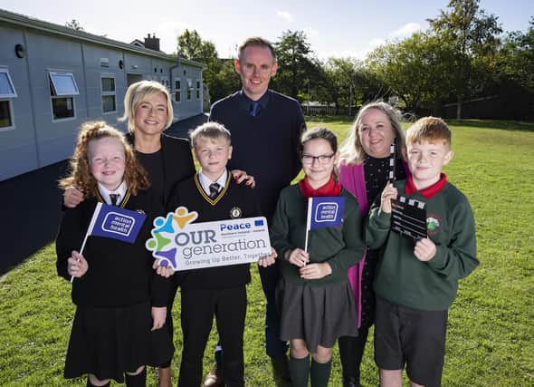 Nicola McKeown – Acting Vice-Principal, Christ the Redeemer PS, Neil Watson, Acting Principal, Christ the Redeemer PS, Jane McConville, ICT Co-ordinator Elmgrove PS, with pupils: Abbie McGauley, aged 10, Fionn McCarty, aged 10, Aimee Crawford, aged 10, Archie Young, aged 10