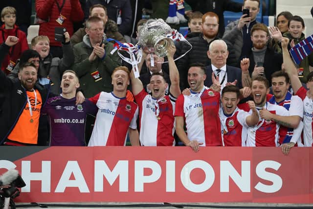 Linfield captain Jamie Mulgrew lifts the BetMcLean Cup in 2019 - their last success in the competition