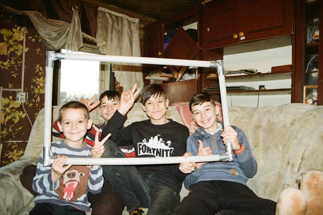 Ukrainian children with one of Insulate Ukraine's innovative windows