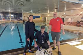 Sarah Jane Reynolds from Swimming Buddies alongside Lexi the therapy dog with his handler Gary from ADNI and Senior Team Leader and Coach Joel Lawson