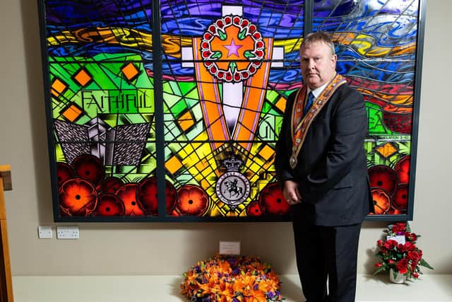 Grand Master Harold Henning at the memorial window at Schomberg House, in East Belfast.