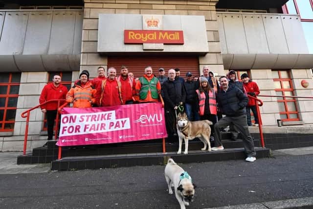 Royal Mail workers at Tomb Street in Belfast on strikes in a long-running dispute over pay and conditions
