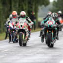 Michael Dunlop (6, Hawk Racing Honda) wheelies off the line alongside Derek Sheils ( (82, Macau Roadhouse BMW) and Davey Todd (74, Milenco by Padgett's Honda ) at the start of the 'Race of Legends' Superbike finale at Armoy on Saturday.