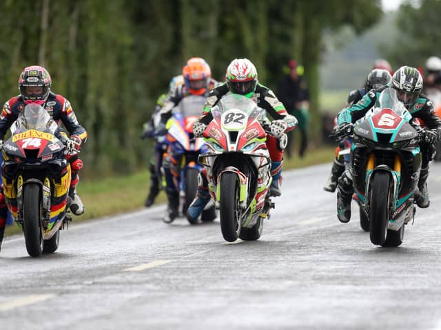 Michael Dunlop (6, Hawk Racing Honda) wheelies off the line alongside Derek Sheils ( (82, Macau Roadhouse BMW) and Davey Todd (74, Milenco by Padgett's Honda ) at the start of the 'Race of Legends' Superbike finale at Armoy on Saturday.