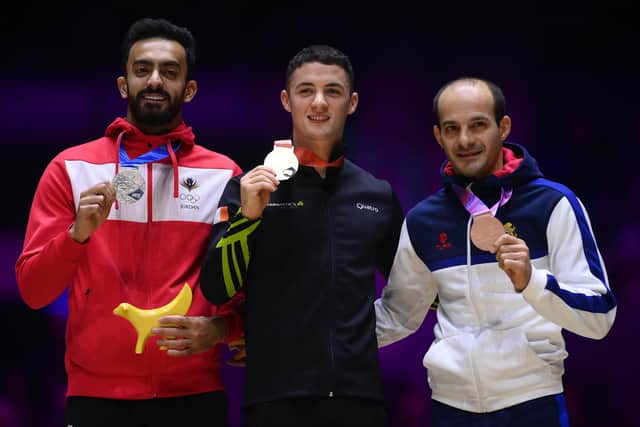 Gold medalist Rhys McClenaghan (C) of Ireland, Silver medalist Ahmad Abu Al-Soud of Jordan and Bronze medalist Harutyun Merdinyan (R) of Armenia pose during the medal ceremony for Men's Pommel Horse Final on day eight of the 2022 Gymnastics World Championships at M&S Bank Arena on November 05, 2022 in Liverpool, England. (Photo by Laurence Griffiths/Getty Images)