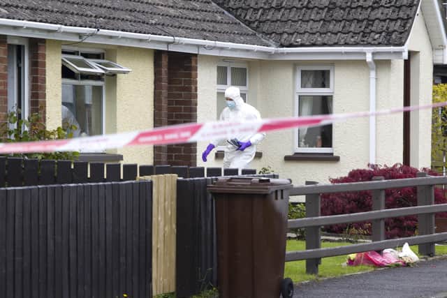 Police officers at the scene of the house fire in Cloughoge on the outskirts of Newry on May 21 2021, which killed Andrew James Thompson. Today, Gary Magee, 44, was jailed for three and a half years for manslaughter and arson offences