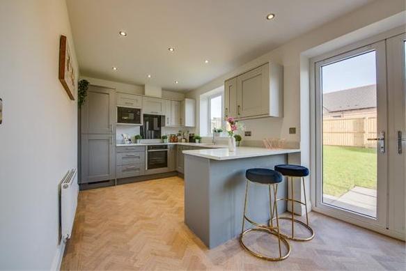A second look at the spacious kitchen diner at the Sheepbridge Park bungalow. Bi-folding doors open on to the patio area and lawned garden area.