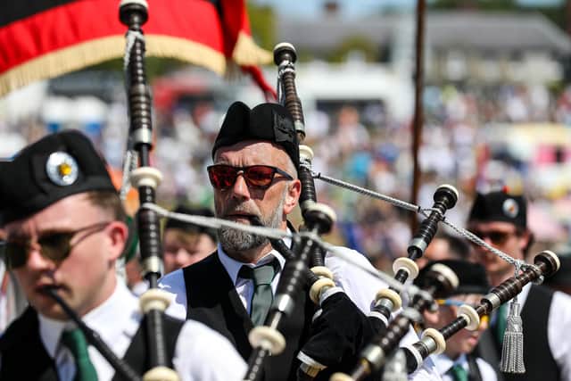 The main street of the village was dominated by many piping bands with their distinctive music.