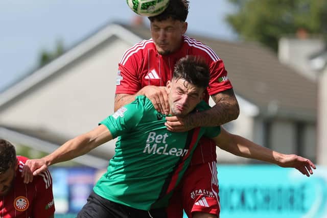Portadown's Baris Altintop rising above David Fisher during a visit by Glentoran to Shamrock Park in the Sports Direct Premiership. (Photo by David Maginnis/Pacemaker Press)