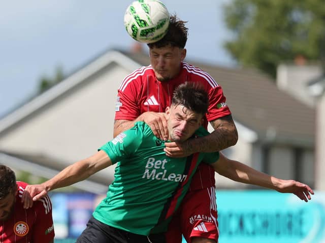 Portadown's Baris Altintop rising above David Fisher during a visit by Glentoran to Shamrock Park in the Sports Direct Premiership. (Photo by David Maginnis/Pacemaker Press)