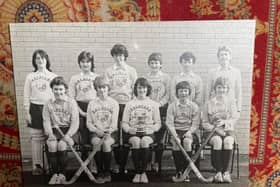 The album features several pictures of girls' hockey teams (some are labelled with late 1970’s and early 1980’s dates). In a couple of the photos, the girls are wearing Dalriada shirts.